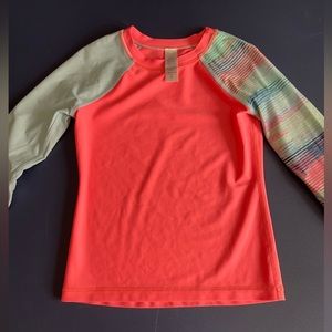Like new, kids size 7 Ivivva rash guard. Neon pink with multi-color sleeves